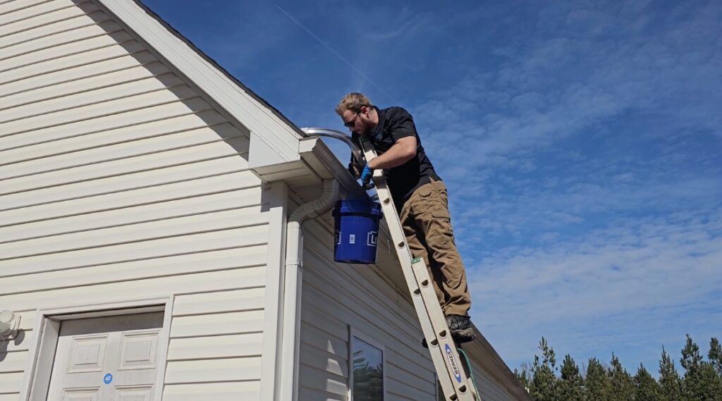 Professional gutter cleaning service in Charlotte, NC – Junk Raider team ensuring debris-free gutters for residential and commercial properties.