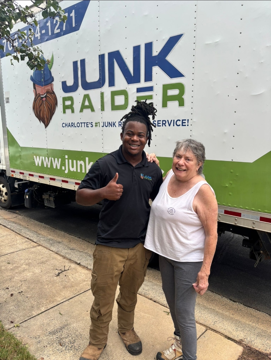 Junk Raider crew member with satisfied customer