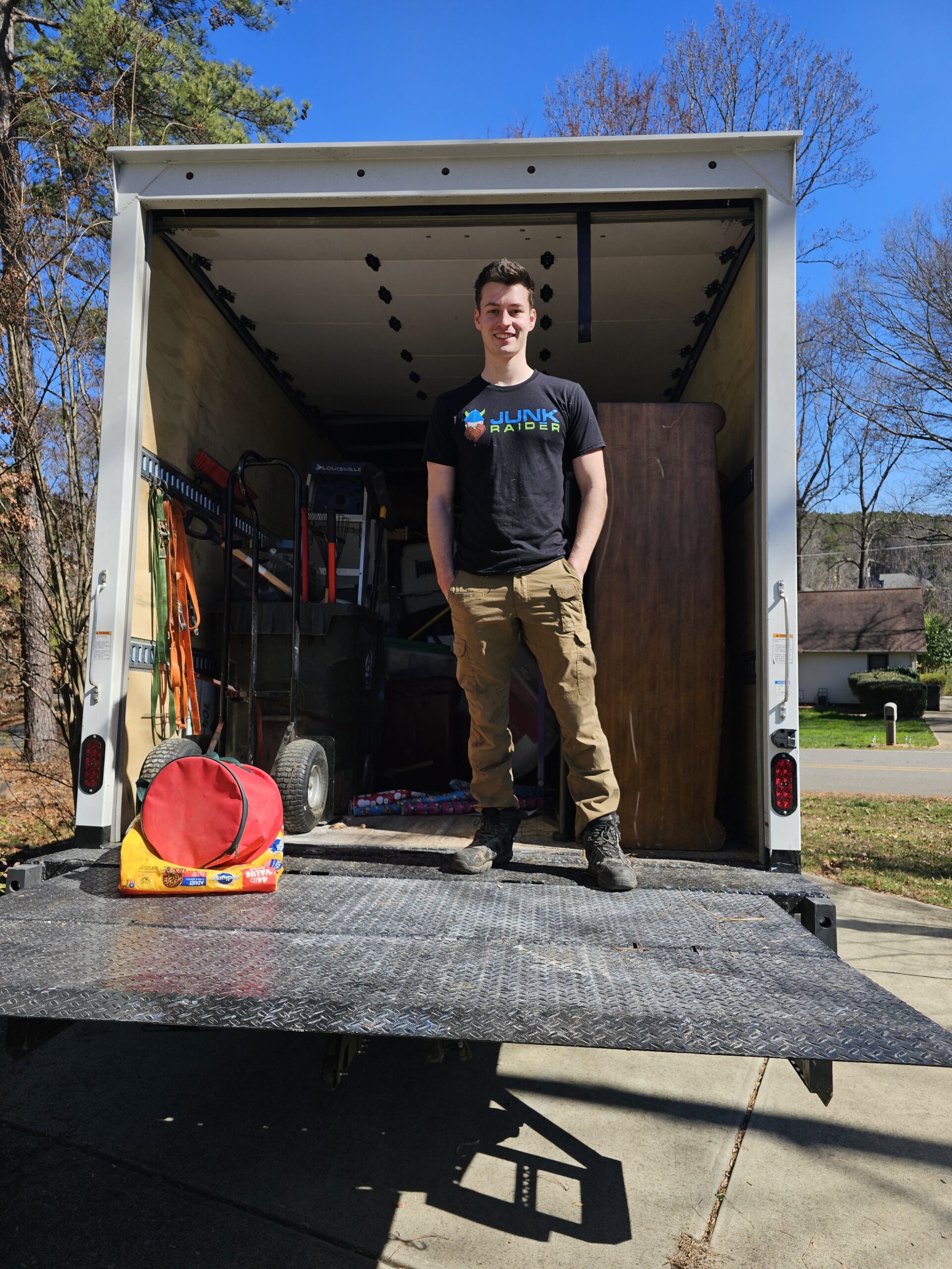 Junk Raider team member inside 20-ft box truck