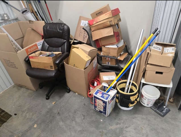 Customer junk pile — boxes, chair, misc items