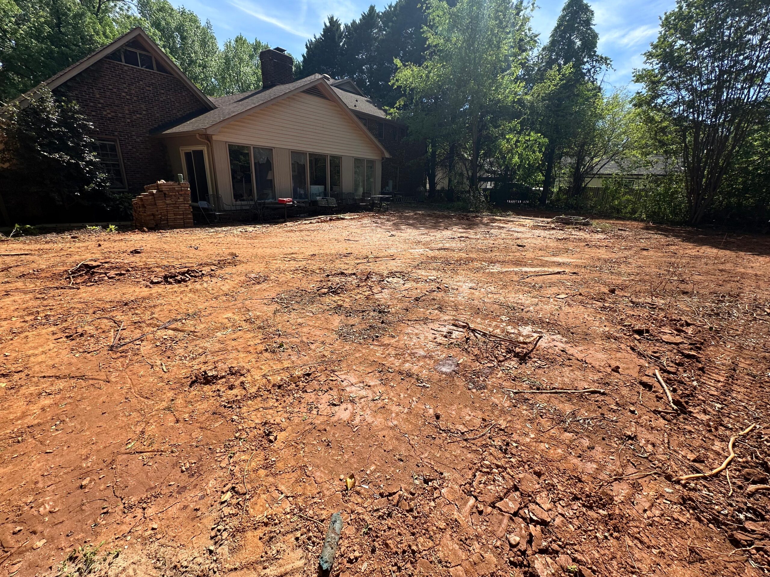 Backyard reclaimed after inground pool removal by Junk Raider in Charlotte