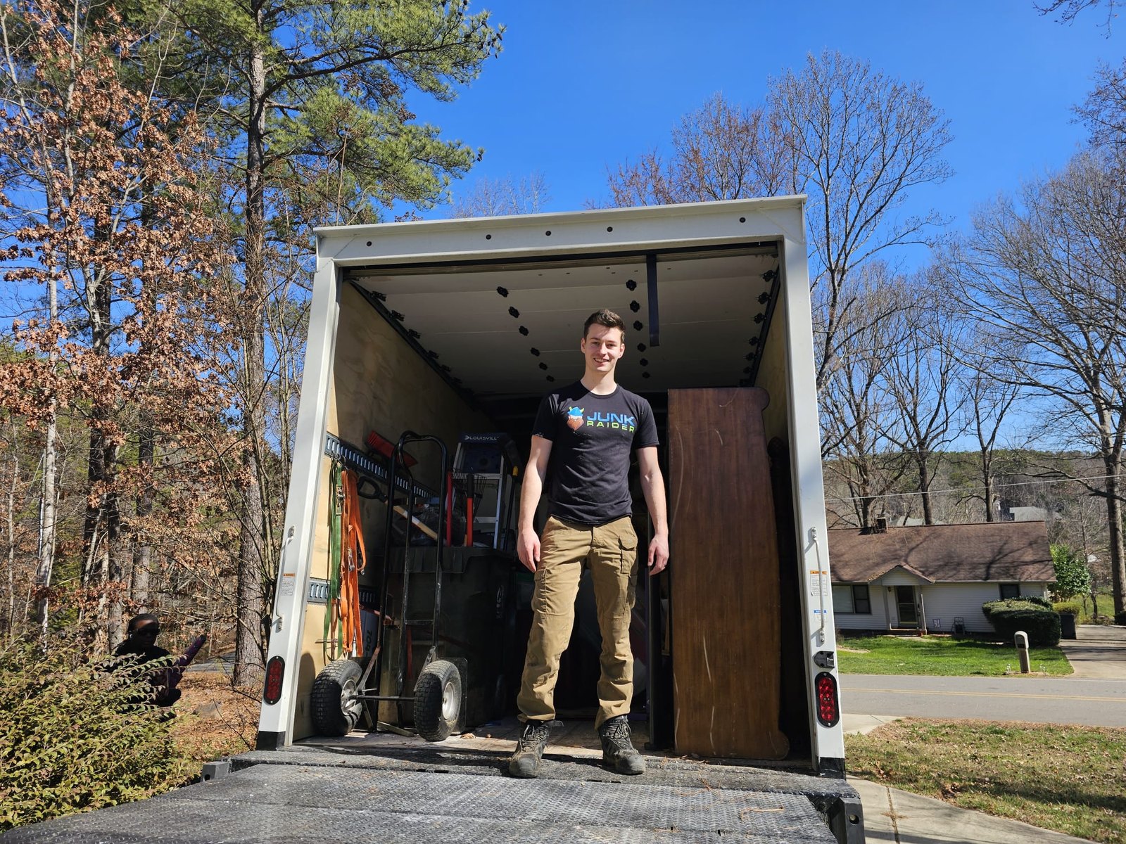 Junk Raider box truck loaded with furniture cleared from a senior living unit in Charlotte, NC